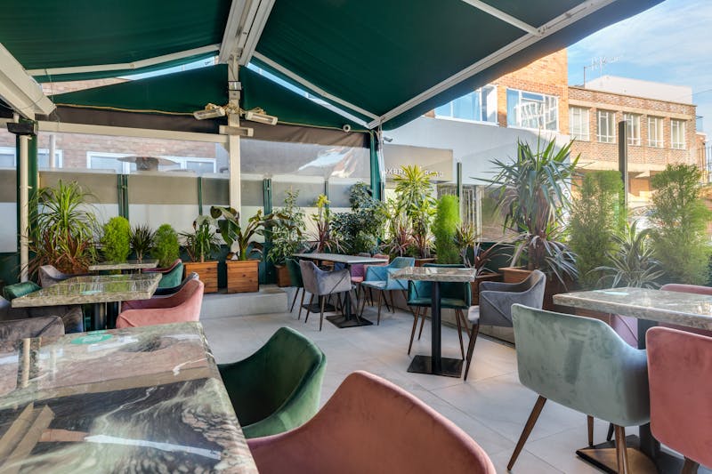 Sunny restaurant terrace with outdoor seating